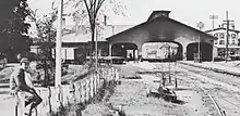 A railway station with a wooden trainshed