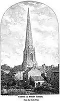 A church, its spire rising far above the few trees and houses around it.