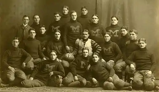 Image 191899 Michigan Wolverines football teamPhotograph: Fred RentschlerOfficial portrait of the 1899 Michigan Wolverines football team, an American football team which represented the University of Michigan in the 1899 season. Coached by Gustave Ferbert, the Wolverines opened the season with six consecutive shutouts, outscoring opponents in those six contests by a combined score of 109 to 0. However, they finished the season by going 2–2 in their final four games, losing against the University of Pennsylvania Quakers and a championship game against the Wisconsin Badgers.More selected pictures