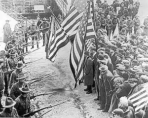 Image 35Striking I.W.W. members confront Massachusetts National Guard troops in Boston, during the Lawrence textile strike in 1912.