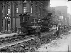 Crane car no. 1 placing rails at Queen and Bond streets (April 29, 1917)