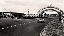 Cunningham's Cadillac Series 61 "Petit Pataud" passing under the Dunlop Bridge during the race.