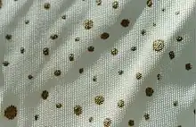 white-background, gold-paint-flecked pattern was used on the 1956 Dodge La Femme's headliner, rain hat, rain coat and umbrella