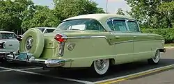 1956 Nash four-door sedan with factory color matched Continental tire with shell cover.