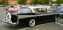 1958 Ambassador by Rambler four-door hardtop with full hub cap within its Continental tire cover.