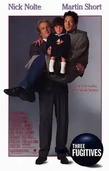 A man holding a smaller man in his arms, with a little girl sitting on the smaller man.