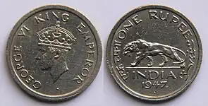 1947 Rupee featuring George VI on obverse and Bengal tiger, year and country on reverse.