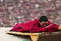 A monk prostrating at a shrine