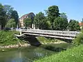 The bridge at its second location near the Ljubljana University Medical Centre. A district heating pipeline marks its appearance.