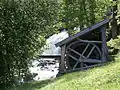 Breastshot water wheel which powered the wood splitting machine in the barn at the farm.