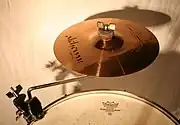 A cymbal mounted on a snare drum rim