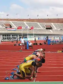 Image 29Men assuming the starting position for a sprint race (from Track and field)