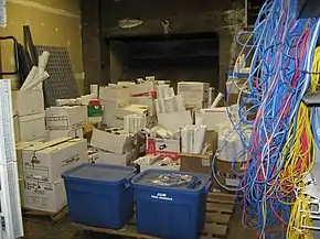 boxes of construction handover documents stored in a boiler room.