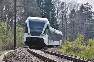 S29 to Winterthur leaving the southern end of the Thurbrücke Ossingen, 2010.