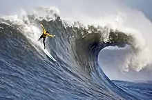  A surfer in the Pacific Ocean at the 2010 Mavericks competition, village of Princeton-by-the-Sea, northern California