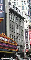 Facade of former Bijou in 2011; between Paramount Theatre (at left), and Boston Opera House (at right)