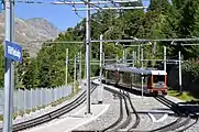 A Gornergrat bound train leaving the station