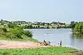 Children playing and fishing in the river