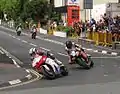 Supersport TT Race 1 Lap 4 – Michael Dunlop (6), Bruce Anstey (5), John McGuinness (3) & James Hillier (1) Parliament Square, Ramsey 3 June 2013.