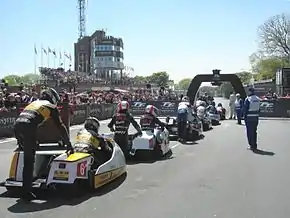 Sidecar TT Race 2 — Competitors line-up to start the race.  TT Grandstand 5 June 2013.