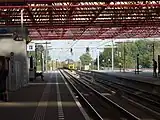 Inside of the station with tracks.