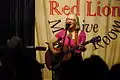 Sue Graves performing at Isleworth's Red Lion pub at a TwickFolk concert, Twickenham Heartbeat, recorded and broadcast live by BBC Radio Wales on 9 March 2014