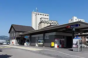 Two-story building with adjoining single-story wing