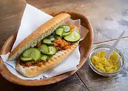 Broodje bakkeljauw is a Dutch-Surinamese bun containing dried and salted cod, here with a chili dip made from Madame Jeanette chili peppers.