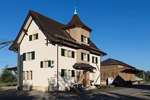 White multi-story building with turret