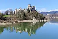 View of Niedzica Castle with the Czorsztyn Castle ruins in the background