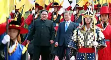 During 2018 inter-Korean summit, Kim Jong Un and Moon Jae-In review South Korean military honor guard.