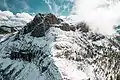 Aerial view of north peak to left, with south peak to right in cloud.