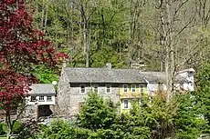 Three unit property in Colonial Revival embellishment style