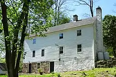 House on Quarry Road with stone bank cellar