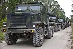 This Oshkosh MTVR MK23/MK25, on which the Oshkosh TAK-4 independent coil-spring suspension is clearly visible, is fitted with an armored cab