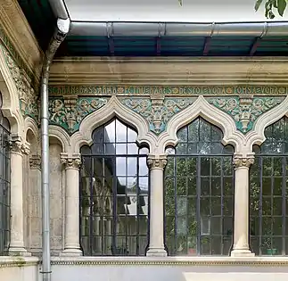 Polychrome ceramic tiles with foliage spirals (aka rinceaux) in the courtyard of the Central Girls' School, Bucharest, by Ion Mincu, 1890