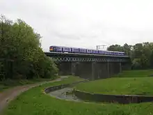 EMU crosses Carr Mill Viaduct St Helens 1st day of electric service Liverpool to Wigan route, May 2015