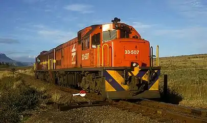 No. 33-507, the only known locomotive of the Class in Spoornet orange livery, at Swellendam, 20 August 2001