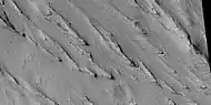 Yardangs, as seen by HiRISE under HiWish program Location is near Gordii Dorsum in the Amazonis quadrangle. Note: this is an enlargement of previous image.