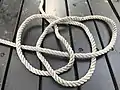 Step three of tying a Celtic Button knot end wowen into loops