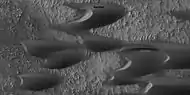 Close view of sand dunes, as seen by HiRISE under HiWish program  A birchen dune is labeled.