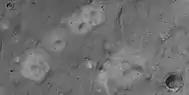 Close view of mud volcanoes and boulders, as seen by HiRISE under HiWish program