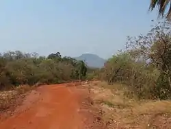 Road in Santa Cruz la Vieja historical park with the mountain Turubó in the background, San José Municipality, Chiquitos Province