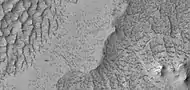 Close view of rough terrain and small pits in Northwestern Schiaparelli Crater, as seen by HiRISE under HiWish program