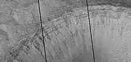 Close view of layers in crater, as seen by HiRISE under HiWish program  Dark line are defects in image.  This image was taken during a global dust storm.