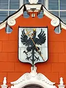 Coat of arms of the city on the facade