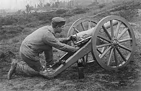 A C/80 in firing position with assembled ammunition.