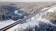 The highway in Priozersky District of Leningrad Oblast. Smorodinka River (Volchya tributary) [ru] flows beneath the bridge on the 46th km of the route.