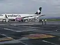 A Volaris A320neo (N530VL) parked at the platform.