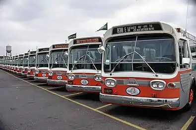 AC Transit first-generation (TDH-5301) 40-ft GM New Look bus fleet in "clownface" with wing logo